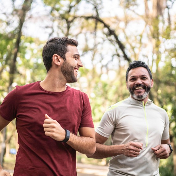 two men jogging with a happy face